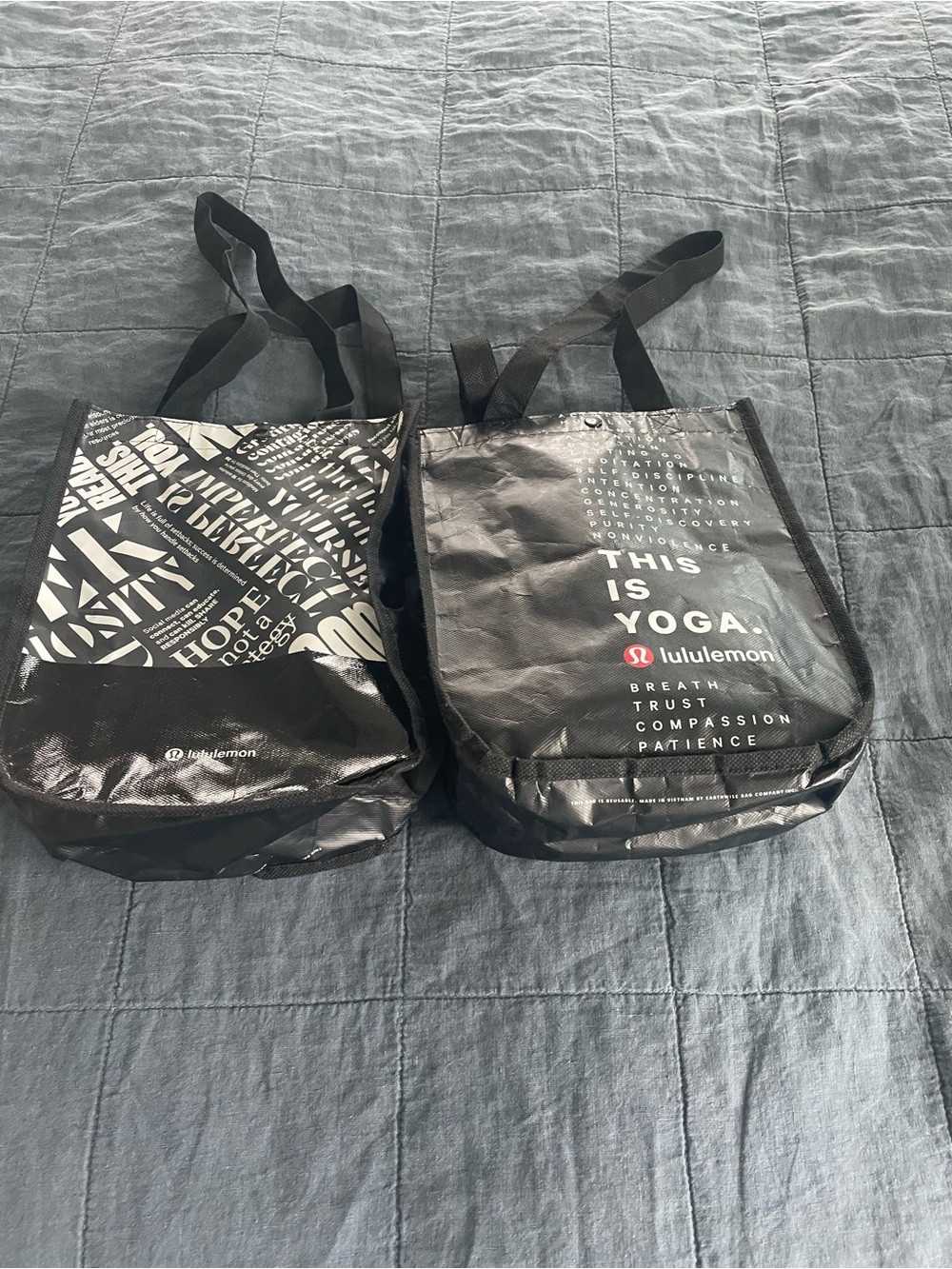 lululemon Black shopping Bags with White Text and Red Logo - 2 for $10.